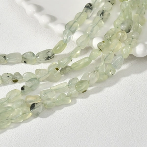Close-up of irregular light green natural semi-precious stone beads for DIY jewelry