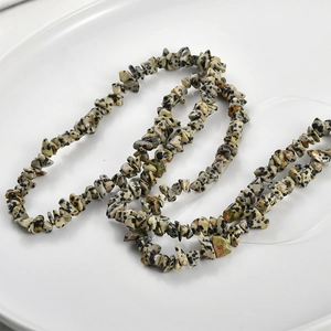 Macro shot of irregular Dalmatian Jasper stone beads for DIY jewelry making