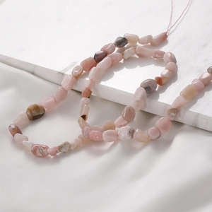 Detailed view of natural pink opal irregular chip beads for jewelry making