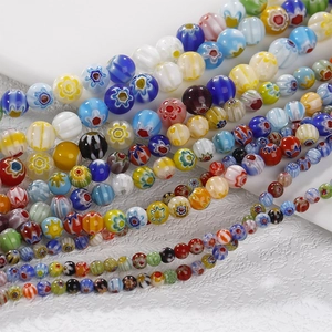 Macro view of colorful millefiori glass beads for DIY jewelry with floral patterns
