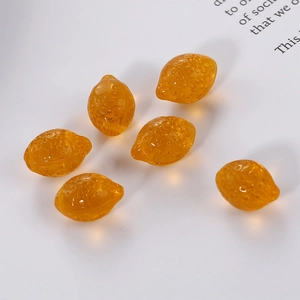 Detailed view of six translucent amber resin lemon charms with realistic skin texture