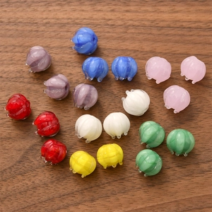 Macro shot of colorful glass lily of the valley flower beads for DIY jewelry making