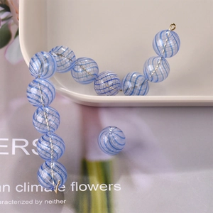 Macro detail of blue and white spiral glass beads for DIY jewelry and necklaces
