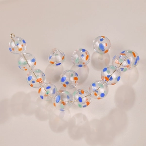 Handmade hollow glass beads with colorful dots for DIY jewelry making and crafts