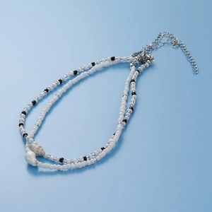 Double-layered beaded beach anklet with ocean shell charms and adjustable silver chain