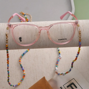 Pink transparent full-frame glasses with colorful beaded chain and 18k gold connectors