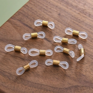 Detailed view of 18k gold-plated spring clips and silicone loops for DIY eyewear chains