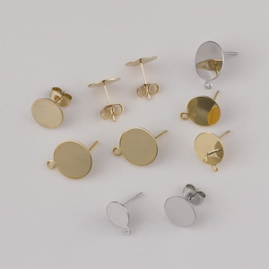 Detailed view of gold and silver plated flat stud earrings with loops for DIY jewelry