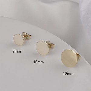 Macro view of gold flat round earring studs in sizes 8mm, 10mm, and 12mm for DIY jewelry