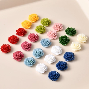 Detailed macro view of colorful resin vintage rose flower patches for DIY jewelry making