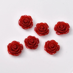 Detail view of 6 red vintage rose flower resin charms for DIY earring and hair accessories