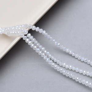 Macro view of 4mm faceted white crystal glass beads for DIY jewelry making and crafts