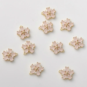 Ten pieces of 14k gold-plated petal flower pendants with pink resin and white zircon