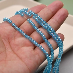 Close-up of 4mm light blue faceted crystal glass beads for jewelry making