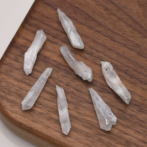 Macro shot of seven natural translucent white crystal pillars for DIY jewelry making