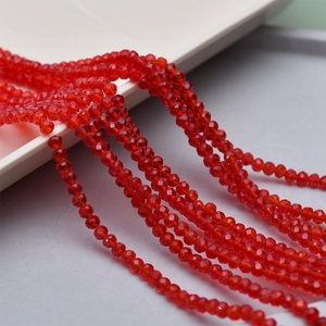 Macro shot of vibrant 4mm red faceted crystal glass beads for DIY jewelry making