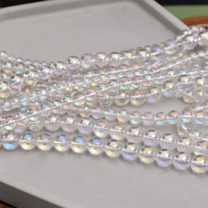 Macro view of iridescent crystal glass round beads showing rainbow luster for DIY jewelry