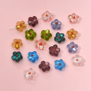 Macro shot of colorful lampwork glass flower beads with foil gold for DIY jewelry