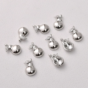 Macro view of 14K gold plated pear shaped jewelry pendants with sparkling zircon leaves