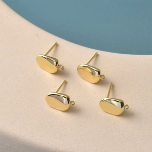 Close-up of 14K gold plated irregular coffee bean stud earrings with hanging loops