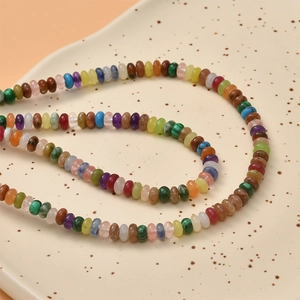 Mixed natural stone abacus beads for DIY necklaces and bracelets on ceramic tray