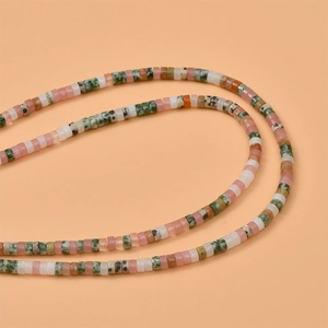 Close-up of multi-colored natural stone disc beads for DIY jewelry making and crafting
