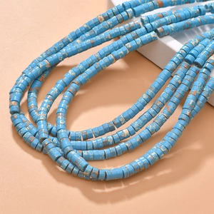 Macro shot of turquoise blue tube beads with marble texture for jewelry making