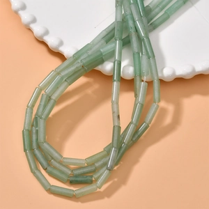 Detail of light green aventurine cylinder beads for DIY jewelry making and crafts