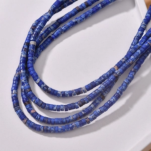Macro detail of natural blue stone cylinder beads for vintage jewelry making