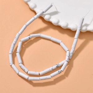 Macro view of white marble texture cylindrical stone beads for DIY jewelry making