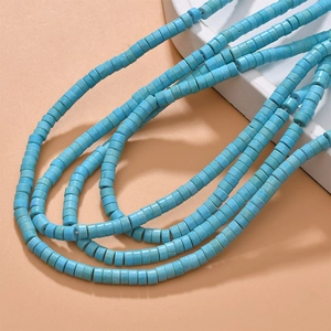 Macro shot of turquoise blue cylindrical stone beads for DIY jewelry and necklaces