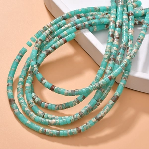 Macro shot of turquoise Heishi cylinder beads with natural marble texture for DIY jewelry