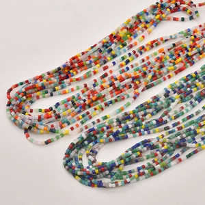 Macro view of tiny 2mm colorful square glass beads for DIY bracelet and necklace jewelry