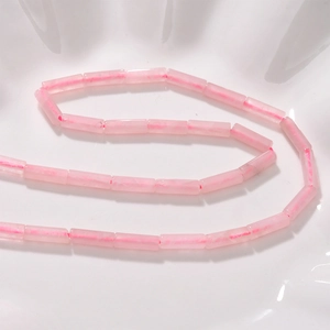 Macro view of cylindrical pink crystal beads with smooth polished finish for DIY jewelry