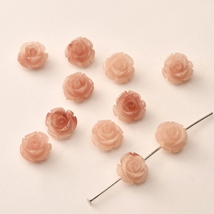 Detail of 12mm pink rose beads with straight holes for DIY jewelry making and crafting