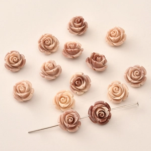 Detailed view of 12mm rose flower beads with holes for DIY jewelry making