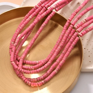 Macro view of rose red natural stone cylinder beads for DIY jewelry making and crafts