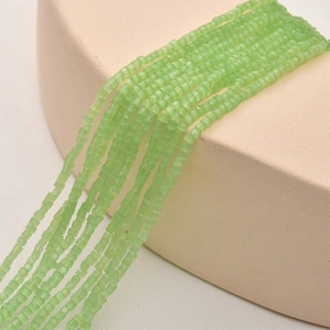Close-up of 2mm matte mint green square glass beads for DIY jewelry making