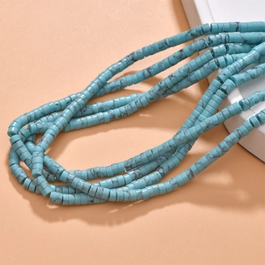 Macro shot of turquoise blue tube beads with marble texture for DIY jewelry making
