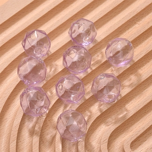 Macro shot of faceted light purple translucent glass beads for DIY jewelry making