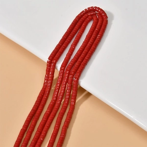 Detailed view of polished red cylinder stone beads for DIY jewelry and necklaces