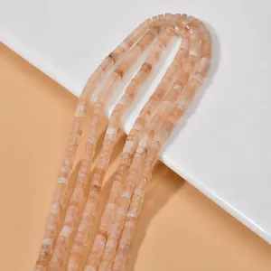 Macro view of natural orange cylindrical stone beads for DIY jewelry making