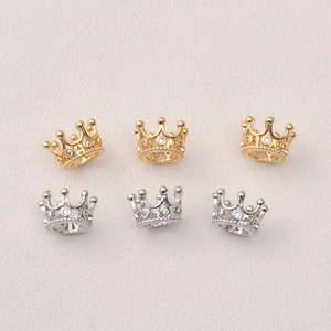 Macro detail of 14k gold and silver plated crown spacers with inlaid zircon for DIY jewelry