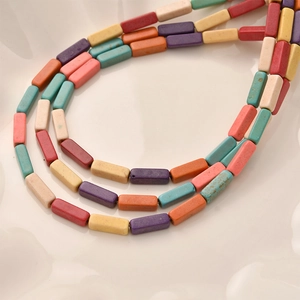 Macro shot of colorful bohemian rectangular stone beads with natural textures for DIY jewelry