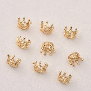 Detailed view of 14k gold-plated hollow crown charms with zircon for DIY jewelry making