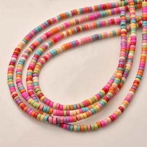 Macro shot of colorful flat polymer clay Heishi beads for DIY jewelry making and crafts