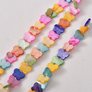 Macro shot of colorful butterfly-shaped natural mother of pearl shell loose beads