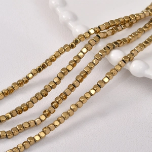 Close-up of 3mm gold-plated cube hematite beads for DIY jewelry making accessories