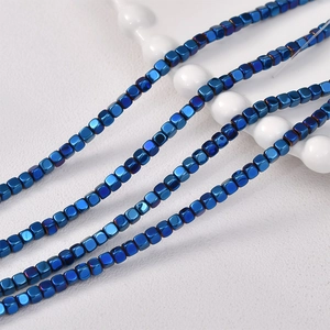 Macro view of 3mm metallic blue square hematite beads for DIY jewelry making and crafts