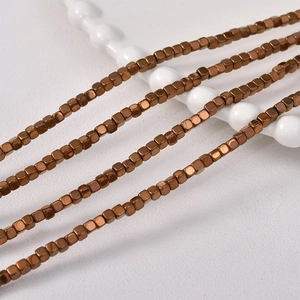 Macro shot of 3mm bronze hematite cube beads for DIY jewelry making and crafts